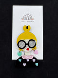 Girl with Yellow Bun Glasses and Heart Shirt Acrylic Needlminder